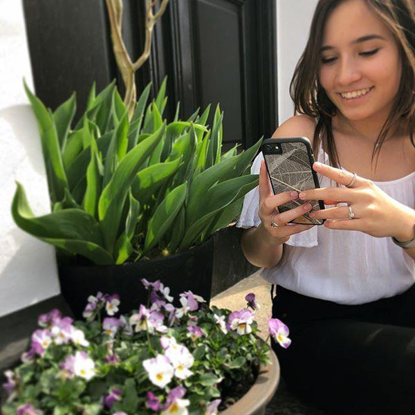 iPhone SE Skeleton Leaves Phone Case Held by a Woman