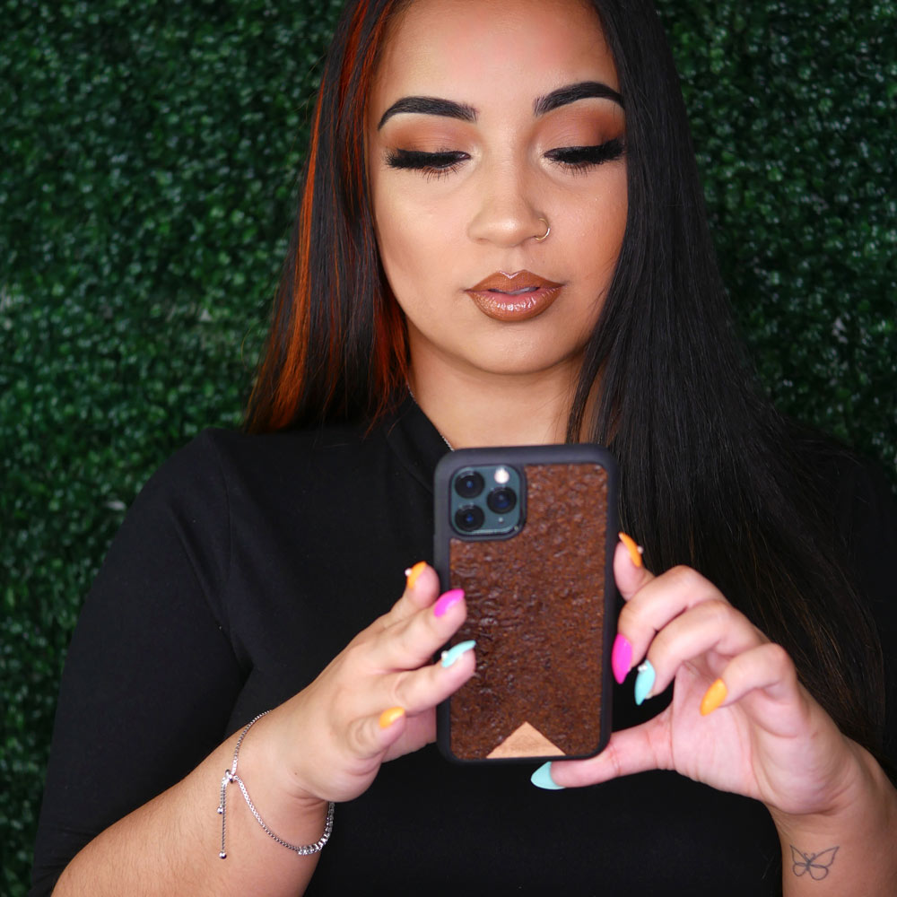 Influencer hoding organic coffee phone case