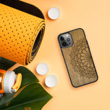 Engraved Mandala Wood Phone Case Flatlay with Yoga Mat