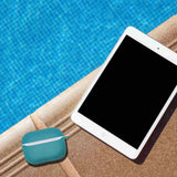 Apple Airpods Pro Ocean Blue Case and iPad next to a Pool