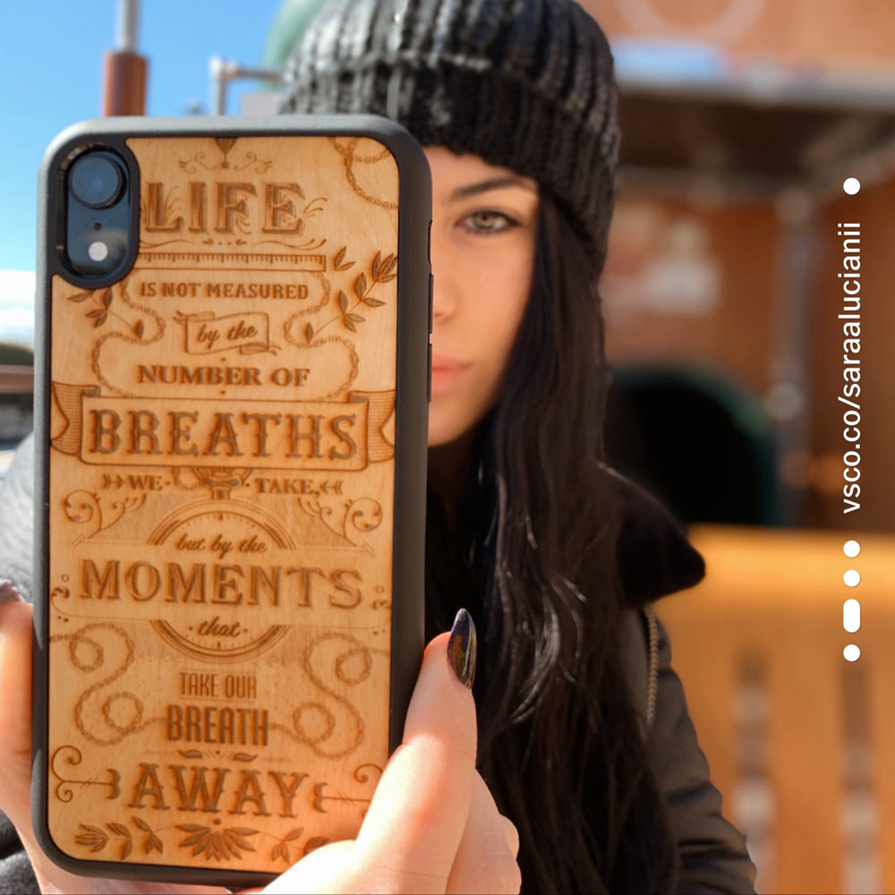 woman Holding the meaning phone case in hands