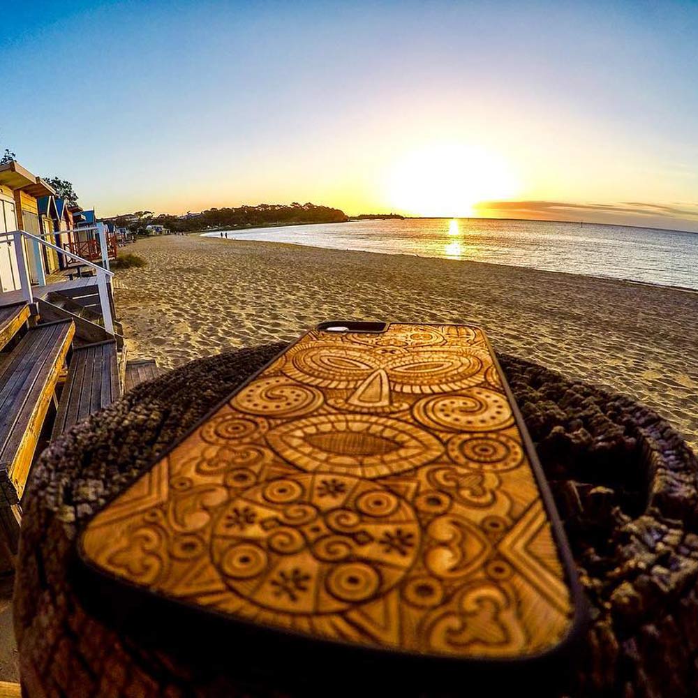 Wooden Tribal Mask Case on the beach