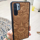 Wooden phone case tribal mask in hands