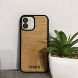 Wooden Venice Phone Case with a plant