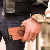 Mahogany wood compass phone case in hands