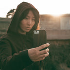 Influencer taking a picture with Ziricote Case